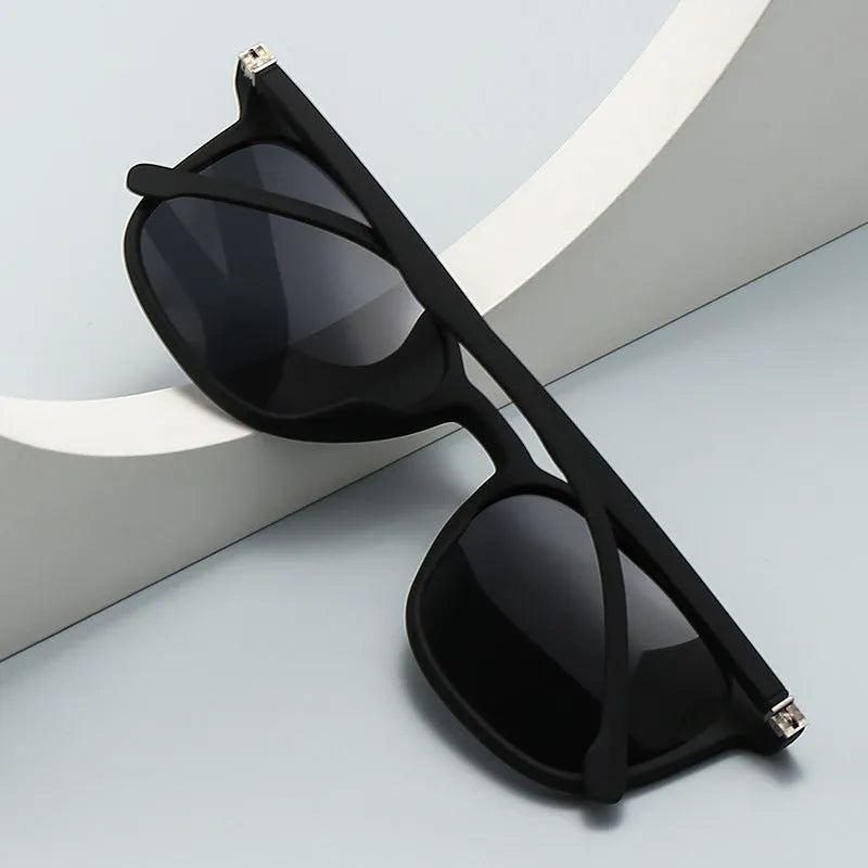 Men's polarised sunglasses with a polycarbonate frame and elastic spectacle foot, shown in various colour combinations.