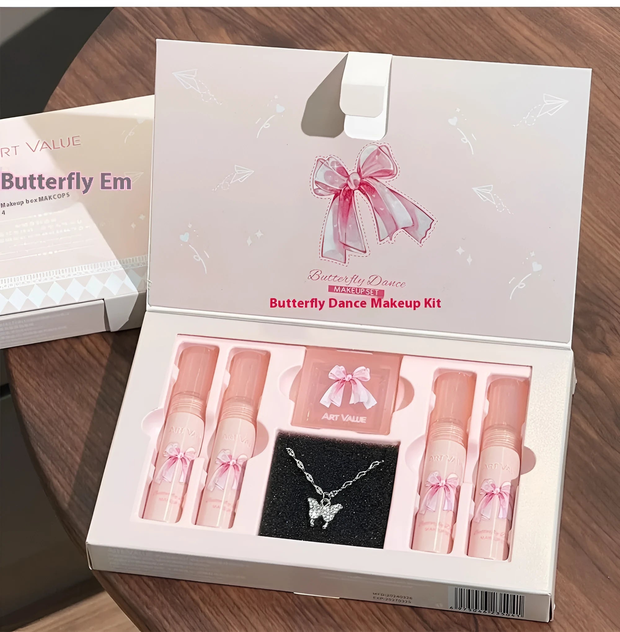 Butterfly Box makeup set showing four pink lip muds, a powder blusher, and a necklace