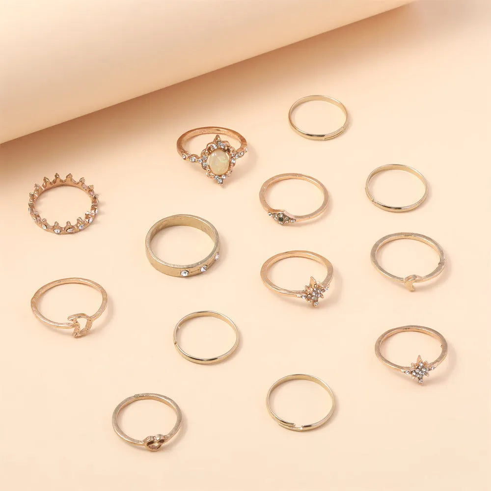 Vintage star moon rhinestone ring set of 13 pieces in gold and silver on display