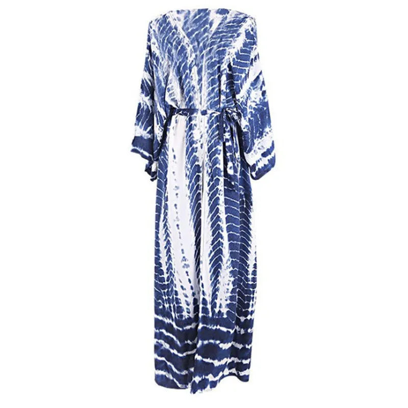 Women's printed loose-fit cotton beach cover-up shirt in rust red, open over a bikini.