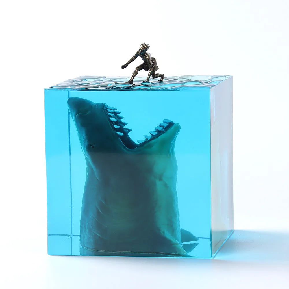 Clear epoxy resin ornament with shark surfing on a wave, includes lamp holder.