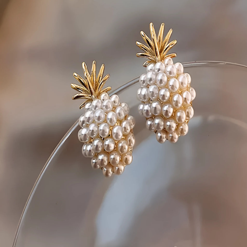 Pineapple and starfish motif drop earrings with pearl and artificial gemstone details on alloy metal