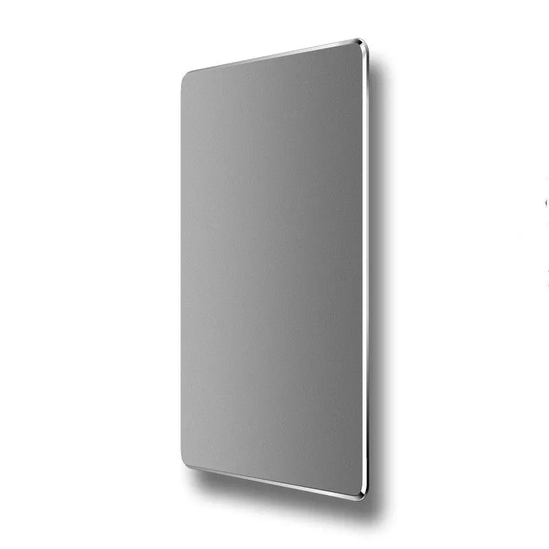 Double-sided aluminium mouse pad in Black on a desk, showing non-slip metal surface and compact size
