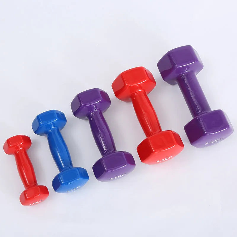 Bright coloured plastic-coated fitness dumbbells in 0.5kg, 1kg and 1.5kg weights for floor-protected workouts