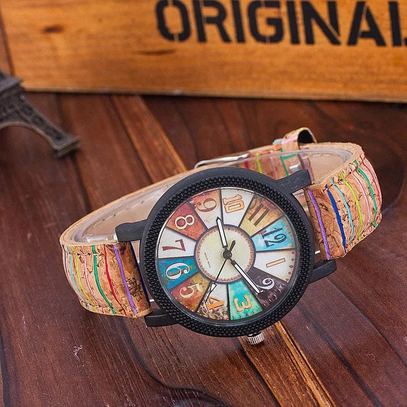 Women's vintage-style quartz watch with brown leather strap and round silver dial