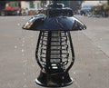 White solar-powered electronic mosquito lamp with solar panel and purple switch for garden outdoor use.