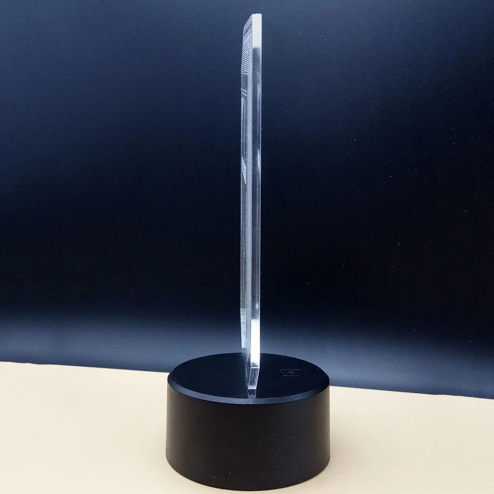 3D acrylic illusion desk lamp with colourful LED lighting on wooden surface