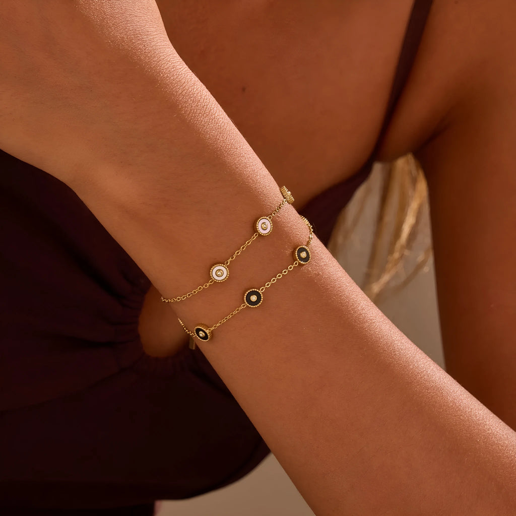Stainless steel women's bracelet with 18K gold plating and geometric fritillary design