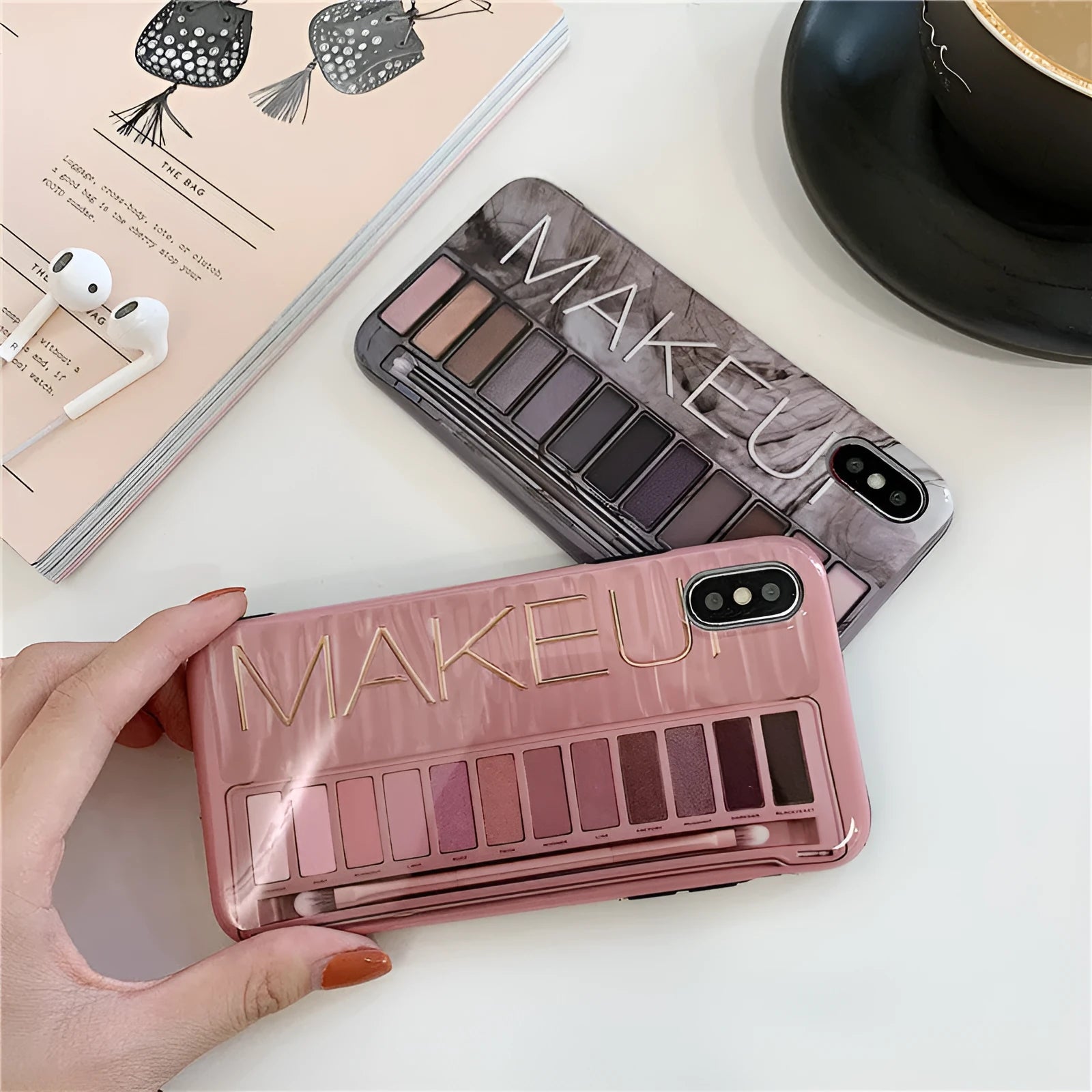 Silicone iPhone case with an eye shadow colour palette design, shown in Flesh and Grey colours.