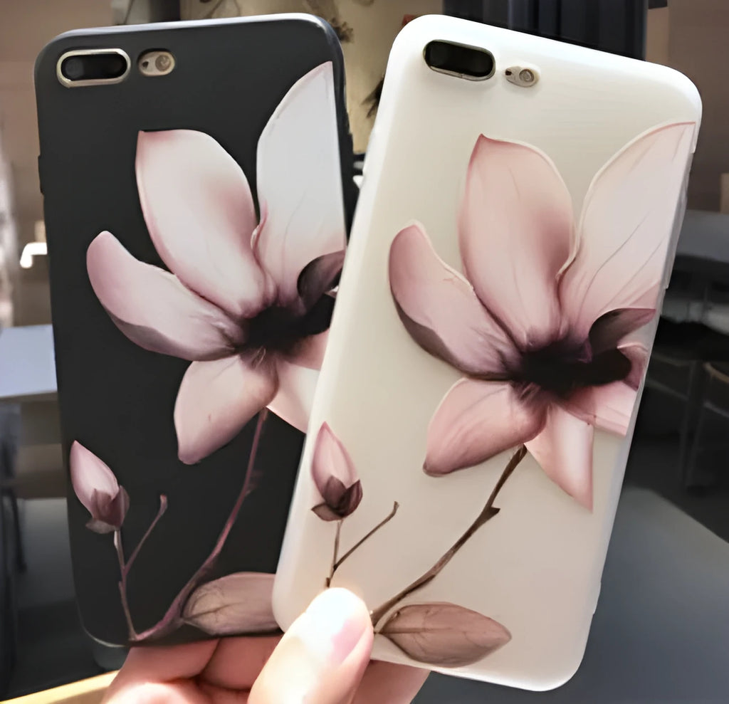 Black TPU iPhone case with a white raised embossed floral pattern on the back.