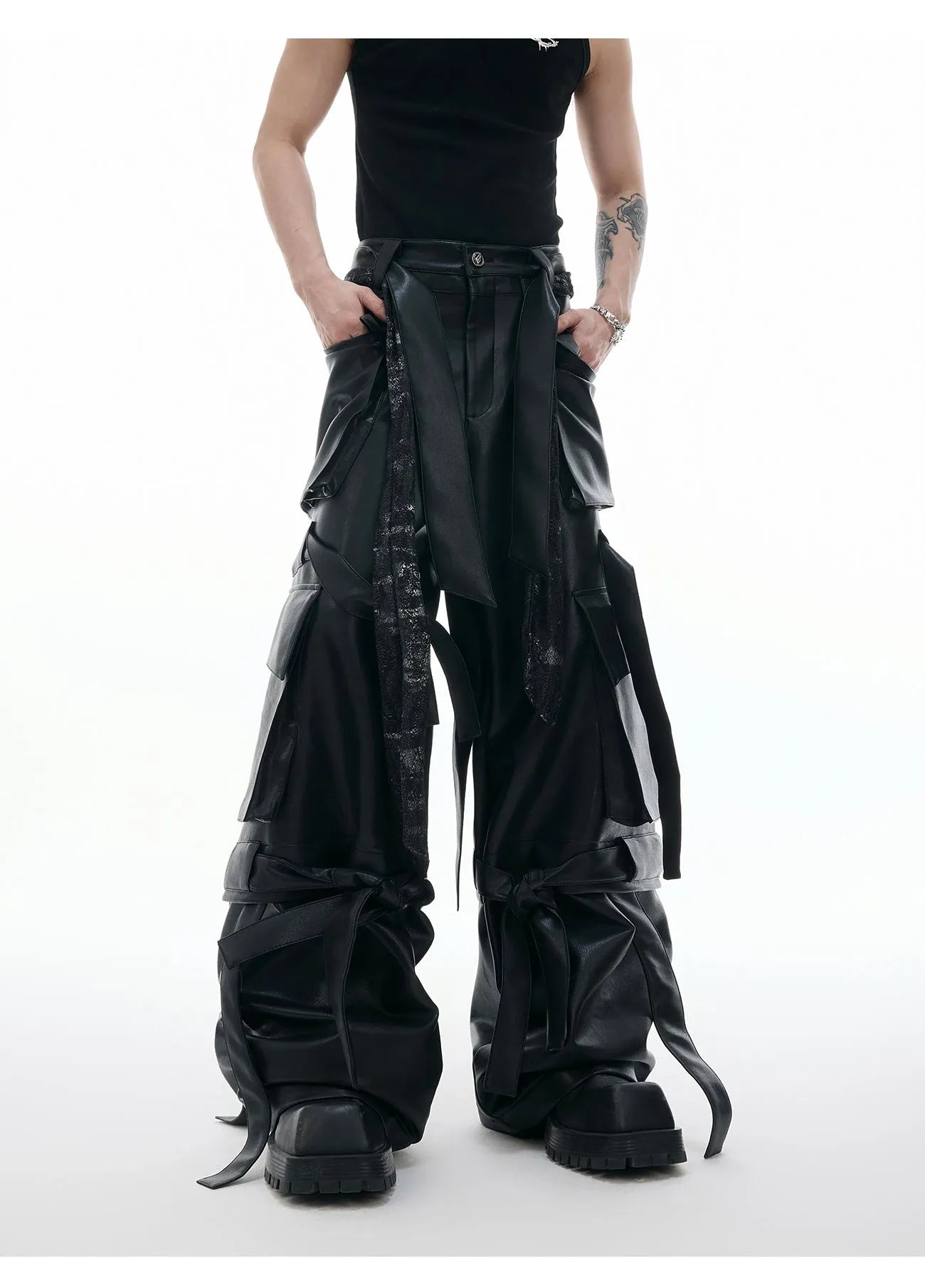 Black retro loose leather pants with quilted panels and multiple pockets