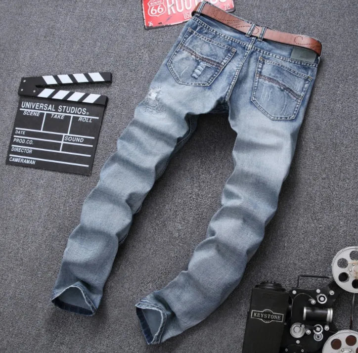 Mens light blue ripped slim fit jeans with distressed denim
