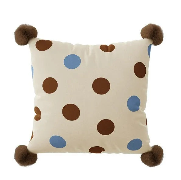 Blue cartoon animal print cushion pillow with removable cover on a grey sofa.