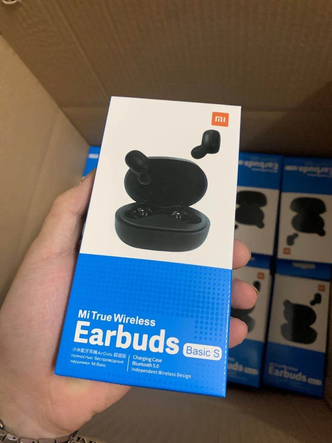 Redmi AirDots True Wireless black earbuds and charging case with three earplug sizes.