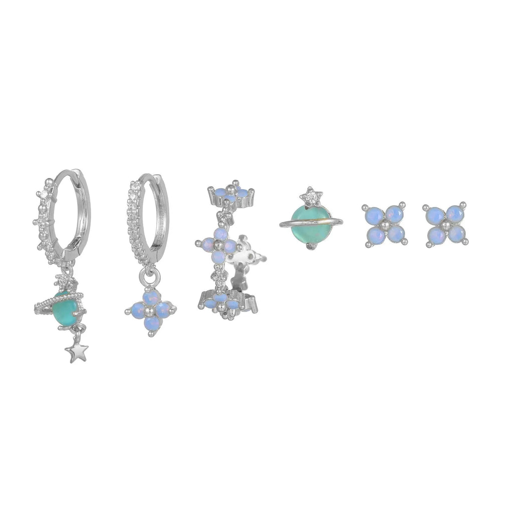 Gold and silver flower shaped stud earrings with zircon mosaic accents on white background