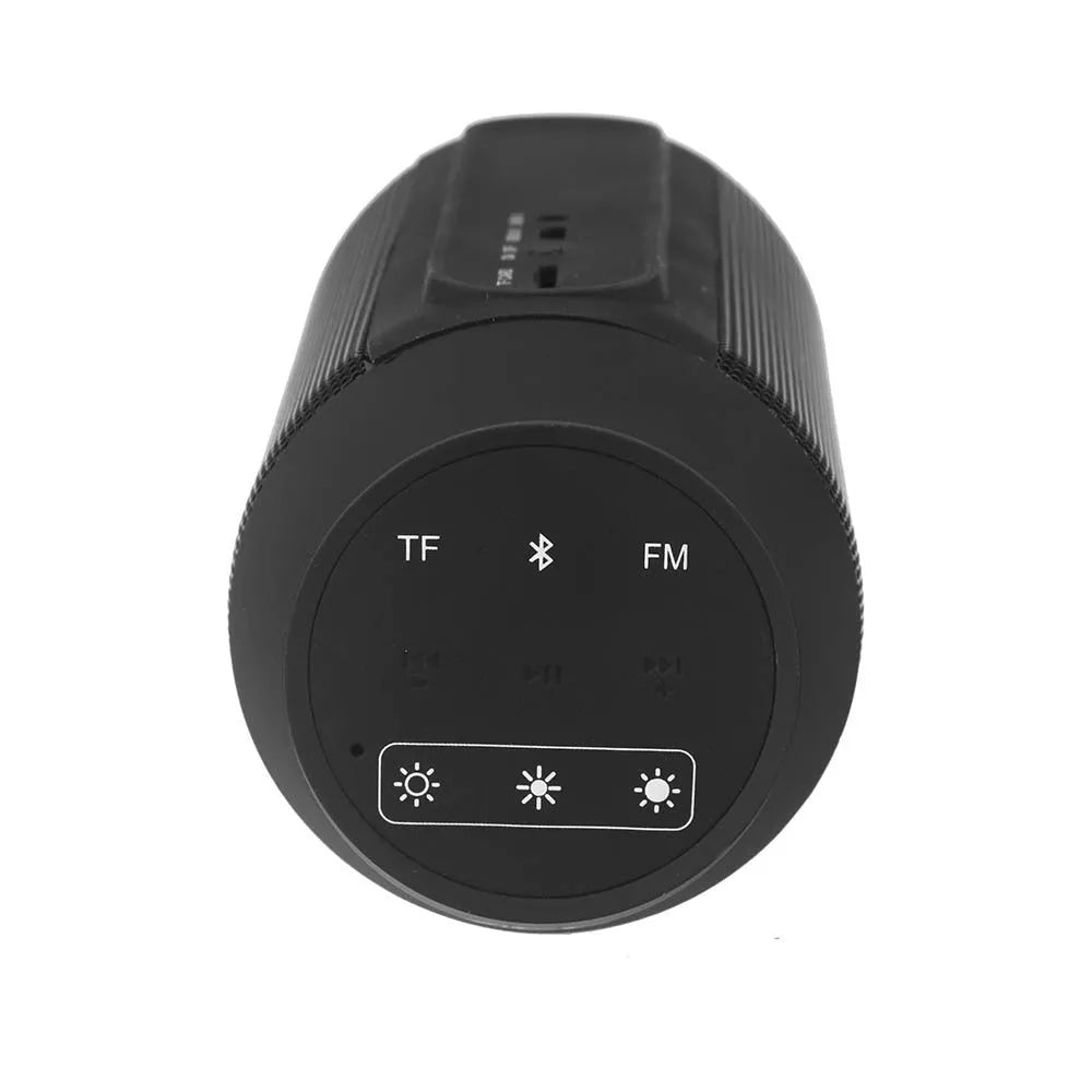 Mini black and white Bluetooth stereo speaker with colourful LED lights on a table.