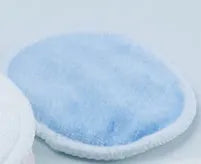 Velvet makeup remover pads in red and blue colours showing soft texture and circular shape
