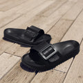 Women's grey blue buckle slippers with a soft EVA sole and single buckle closure.