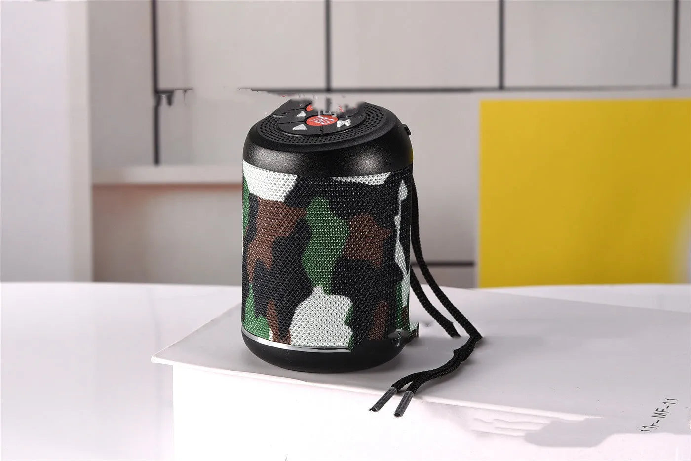 Portable outdoor Bluetooth subwoofer with FM radio and call function in black, blue, or camouflage colour.