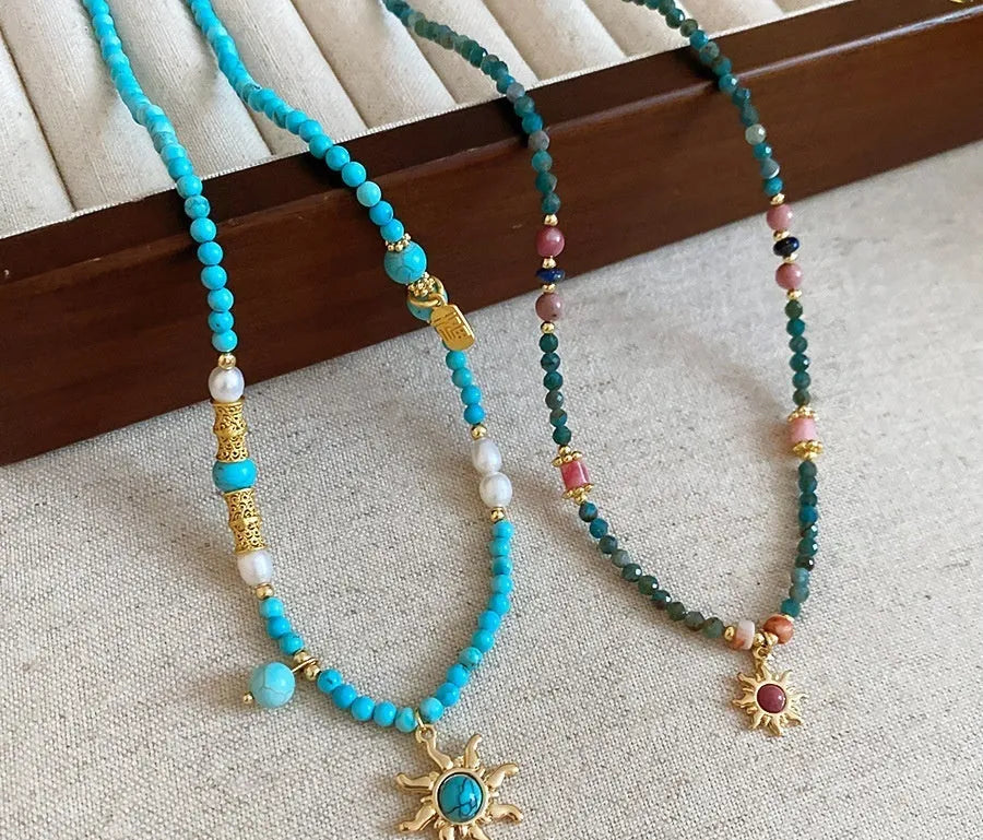 Freshwater pearl necklace with stone pendant and sun charm in geometric French royal court style