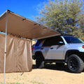 Green two-room camping tent with aluminium poles pitched in an outdoor setting