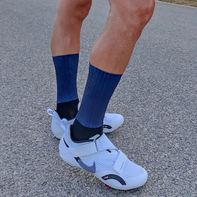A pair of athletic socks for cycling and running in a chemical fibre blend, shown in one of six available colours.