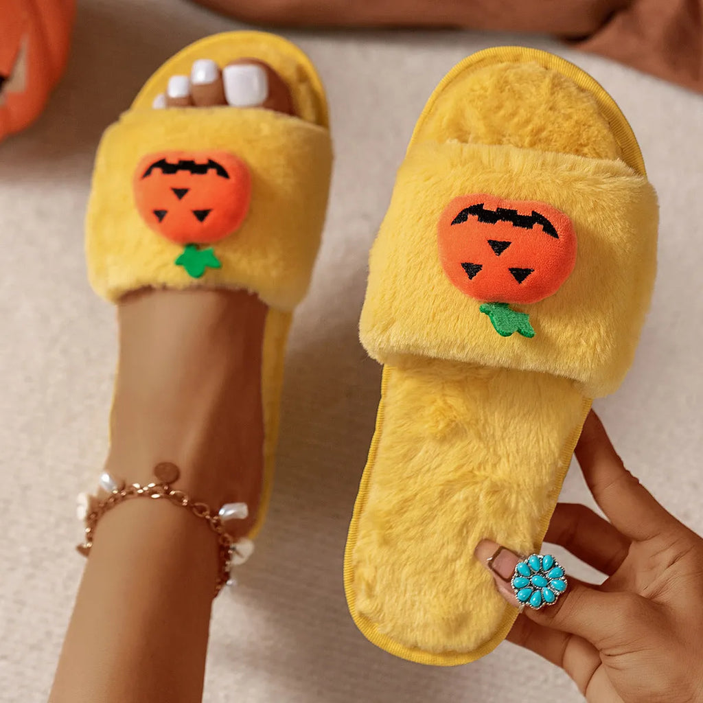 Yellow and white cartoon pumpkin plush slippers with synthetic fur and PVC anti-slip sole.