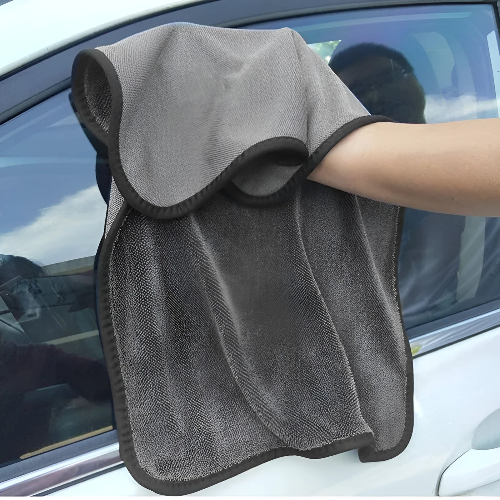 Grey microfiber car wash towel lying flat, showing its 40x40cm square size.