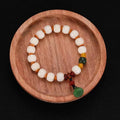 Carved pumpkin lotus Bodhi root bracelet with white jade beads and multiple dimensions