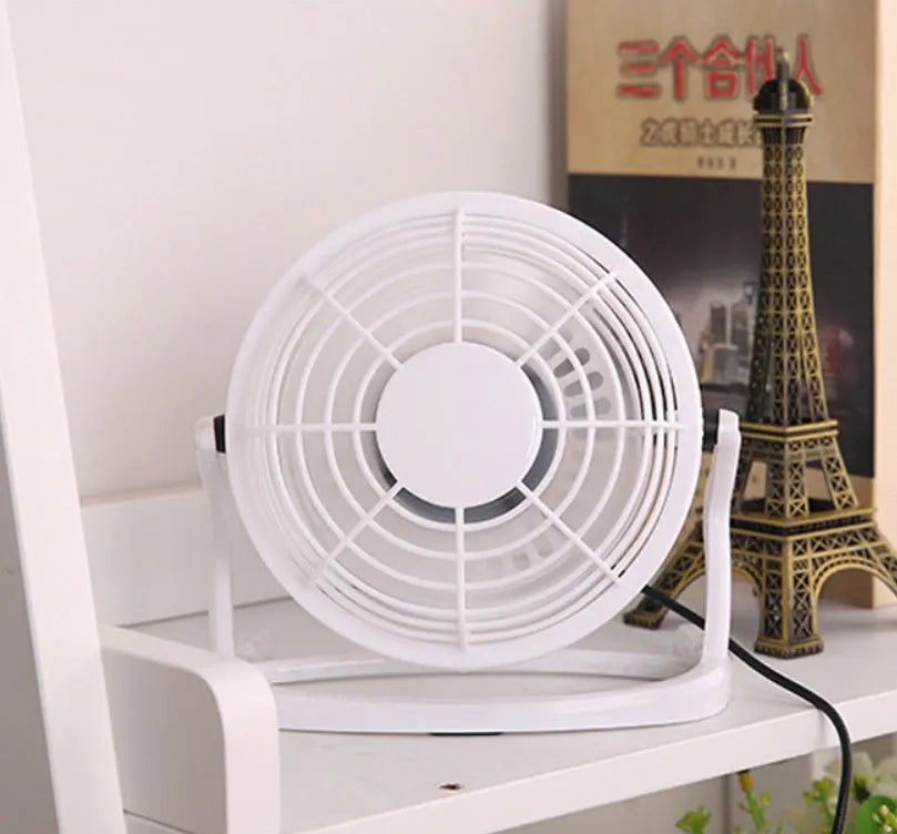 Mini USB desk fan with adjustable angle, black plastic housing, and 96mm blades for laptop cooling