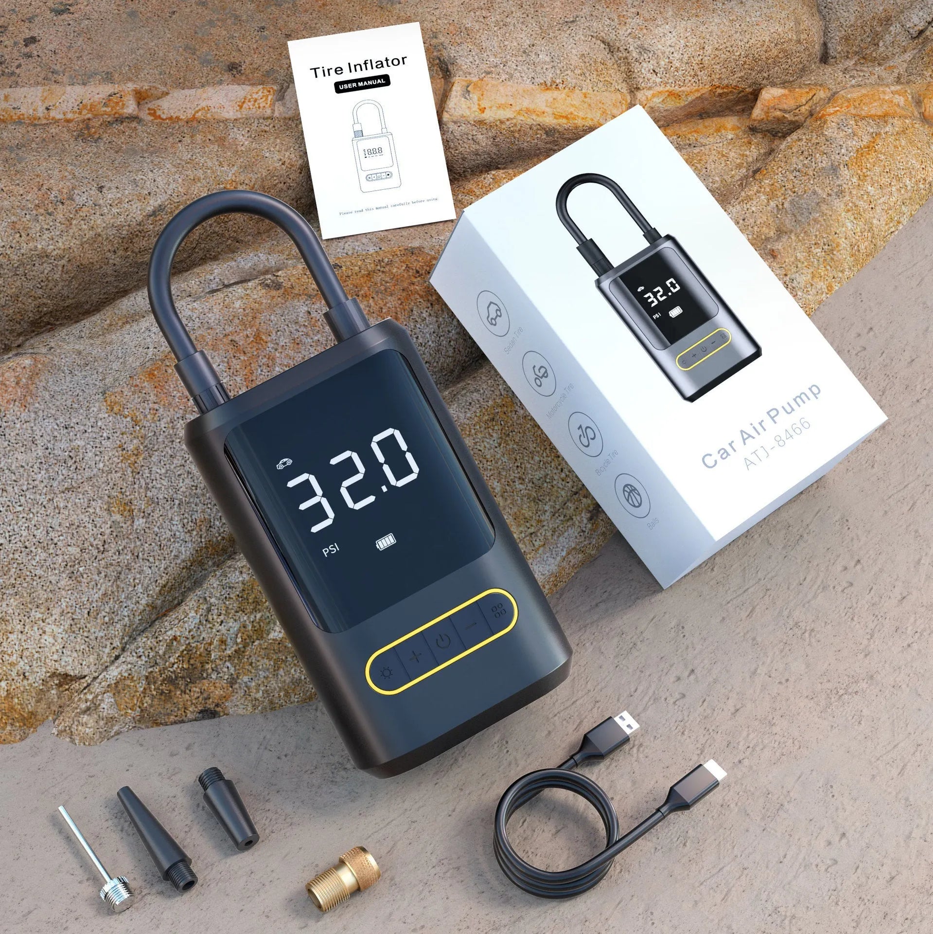 Black handheld digital wireless tyre inflator pump with LED light display on a grey background.