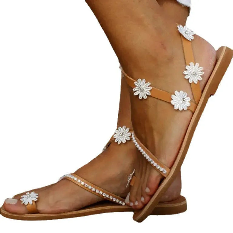 Brown women's Roman sandals with floral decoration and flat rubber sole