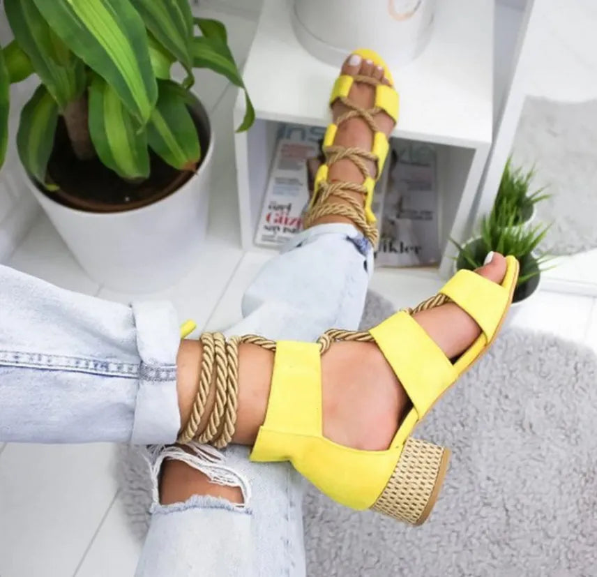Women's beige suede sandals with fish mouth toe, thick heel, and front ankle strap.