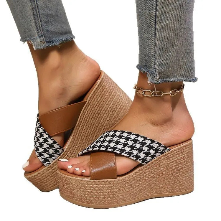 Brown and black plaid wedge sandals with a cross-leopard pattern and a low rubber sole.