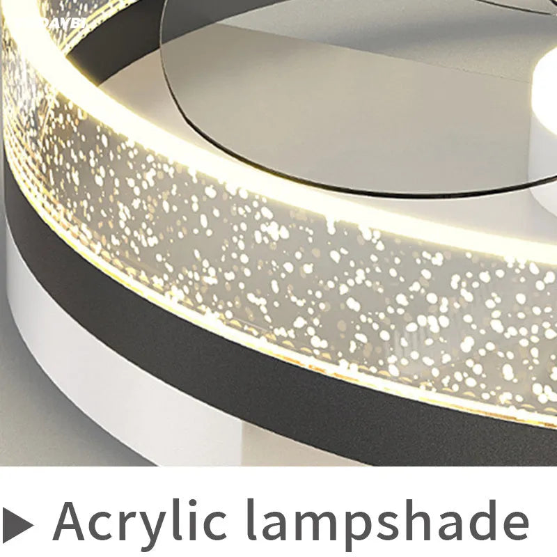 Modern Nordic style white ceiling light with integrated fan blades for a child's room.