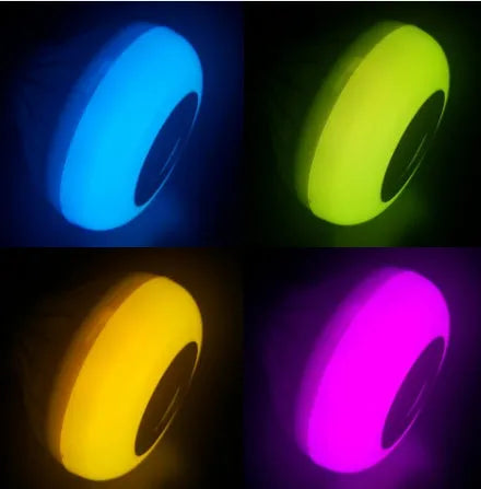 White smart LED bulb with E27 base featuring Bluetooth speaker and remote for colour control.