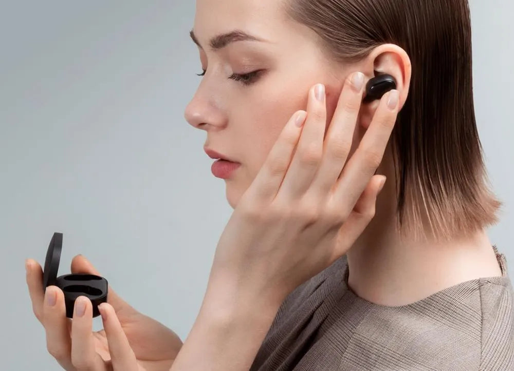 Redmi AirDots True Wireless black earbuds and charging case with three earplug sizes.