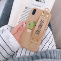 Green graffiti-style iPhone case with an integrated wristband holder on the back.