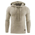 Man wearing a grey cotton-polyester blend hooded sweatshirt, showcasing the casual hoodie design.