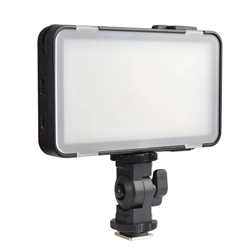 Slim silver Shenniu M150 LED video light with bracket on a mobile phone.