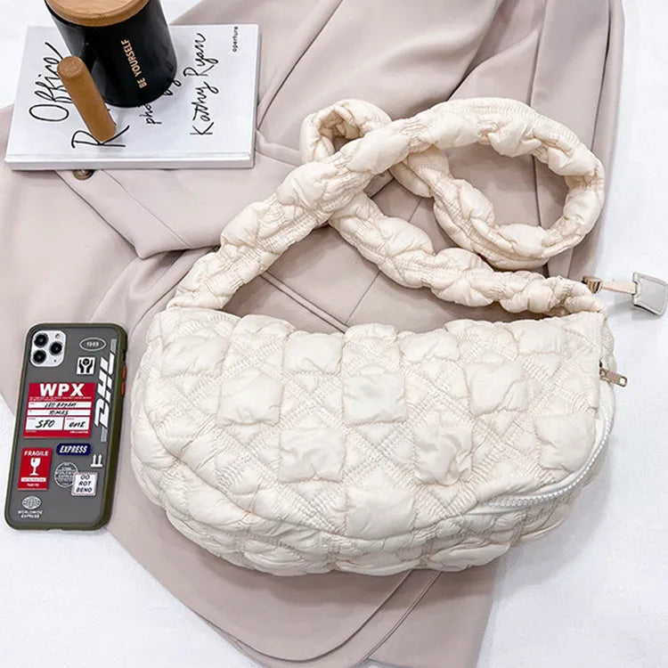 Beige nylon women's casual shoulder messenger bag with a long strap, shown from the side.