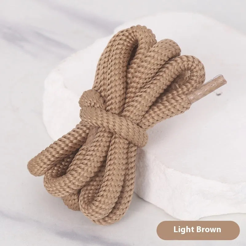 Round oval rope shoelaces in multiple colours including black, pink, blue, and red, shown in different lengths.