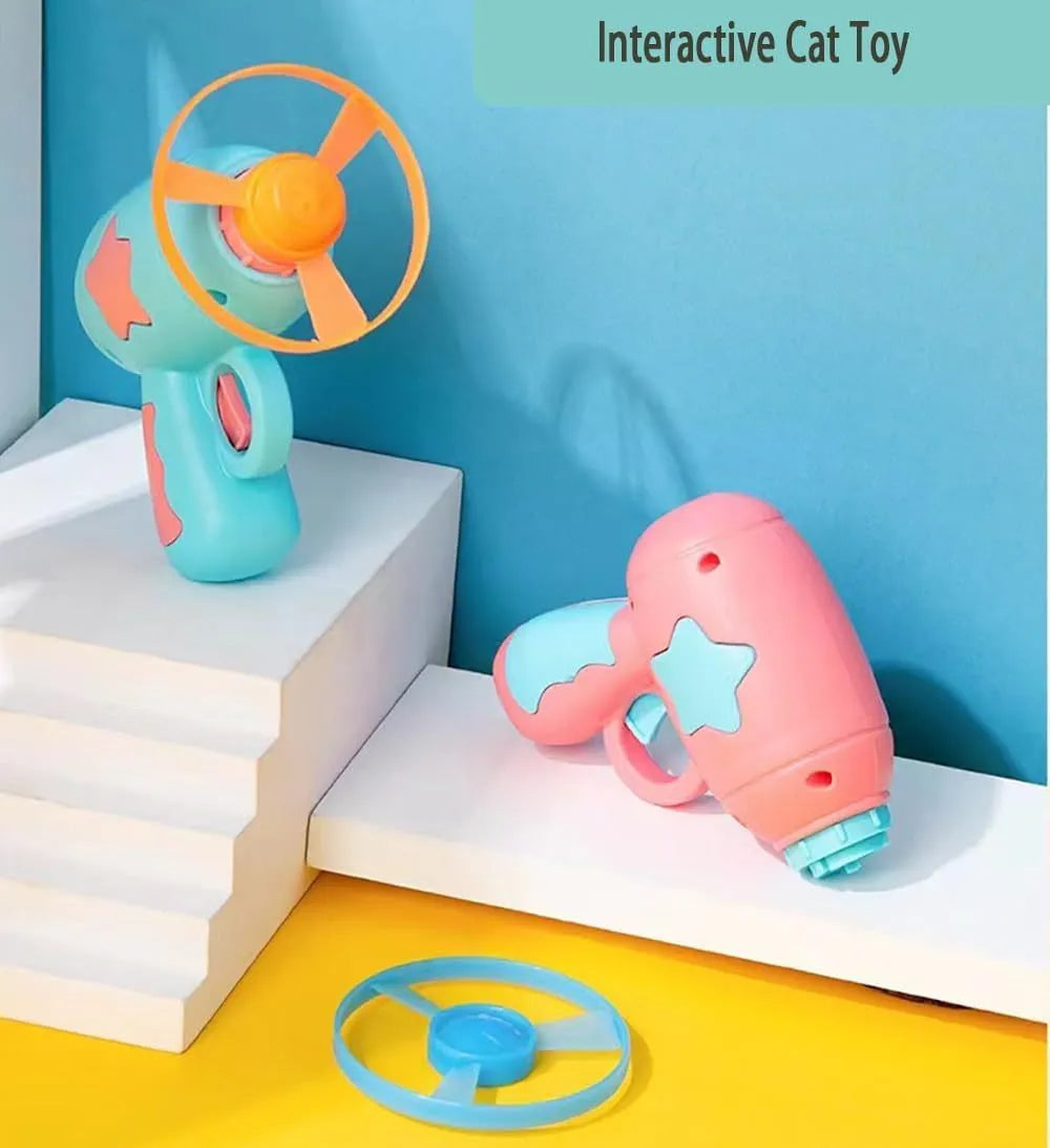 Blue and pink plastic cat toy gun with frisbee measuring 11cm for indoor feline play