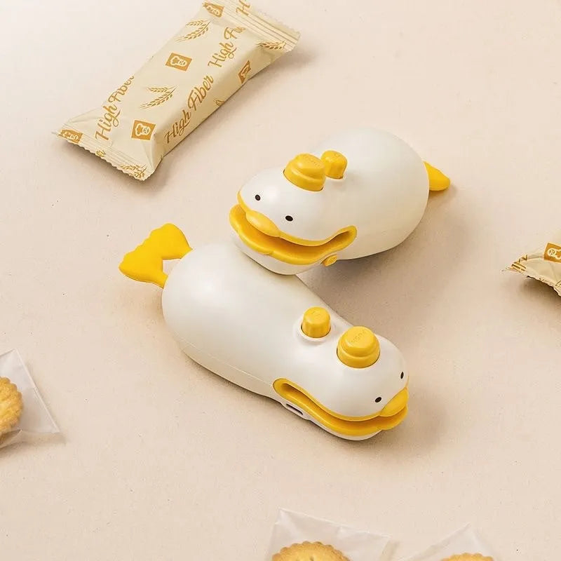 Small yellow duck themed rechargeable sealing machine with animal jacquard design and USB charging cable