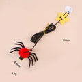 Hanging cat toy with red elastic rope, feather, and bell spider attachment mounted on door