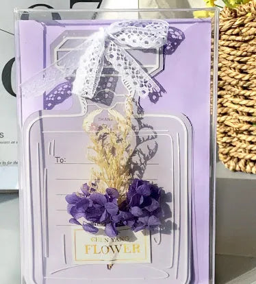 Handmade 3D butterfly-shaped birthday card with artificial flowers and hot foil stamping details.