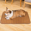 Brown rattan fibre summer cooling mat for dogs on wooden floor