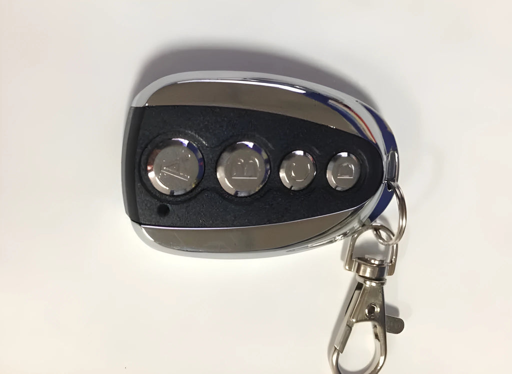 Wireless copy remote control with black metal shell and four buttons for self-learning of radio frequency signals.
