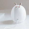 LED cartoon night light in rabbit style showing warm and cold light modes, USB interface, 0.5W power