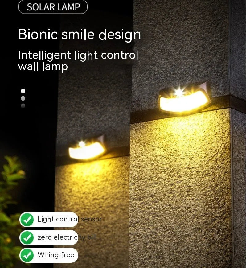 Solar-powered decorative wall lamp with smiling face design for outdoor garden lighting